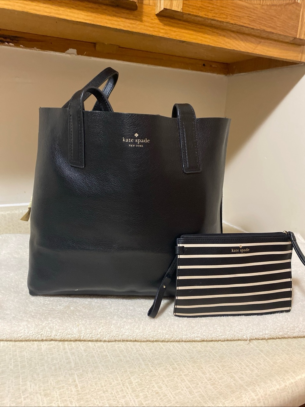 kate spade reversible, tote bag with matching pouch.